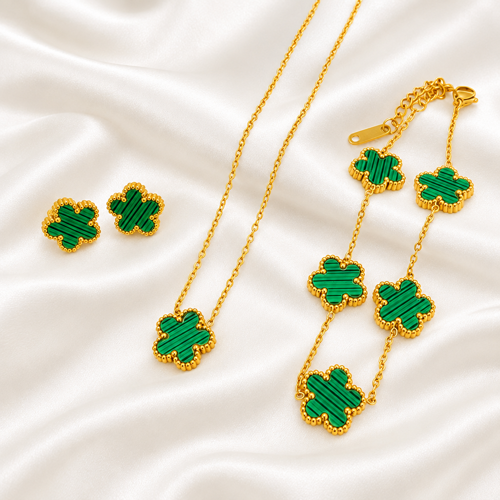 Green five-petal flower necklace, bracelet and earrings on white satin